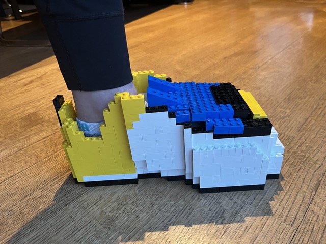 LEGO shoe built and designed by Jordan Ng with Jordan's foot in the LEGO shoe